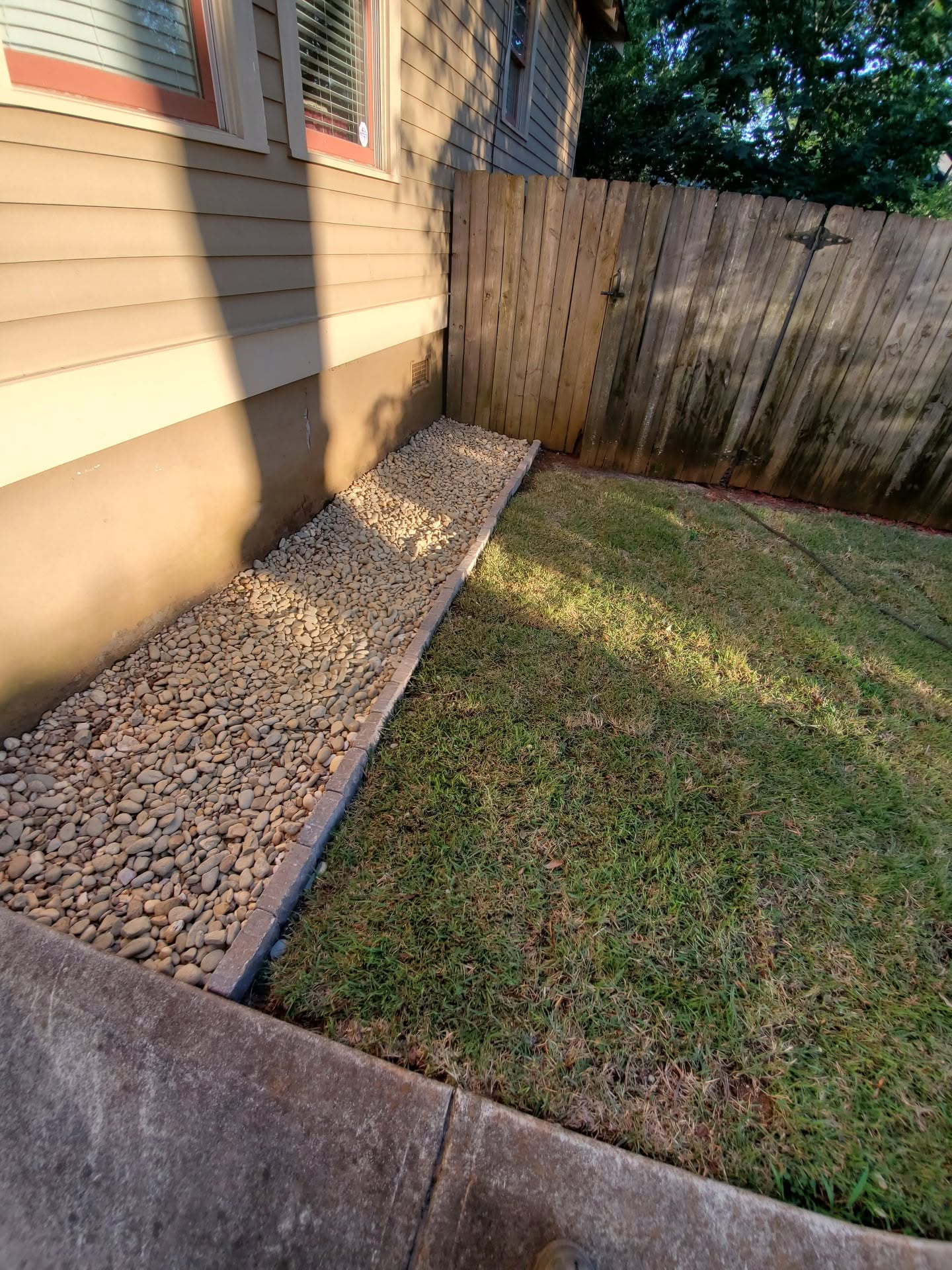 Decorative rock landscaping beside home
